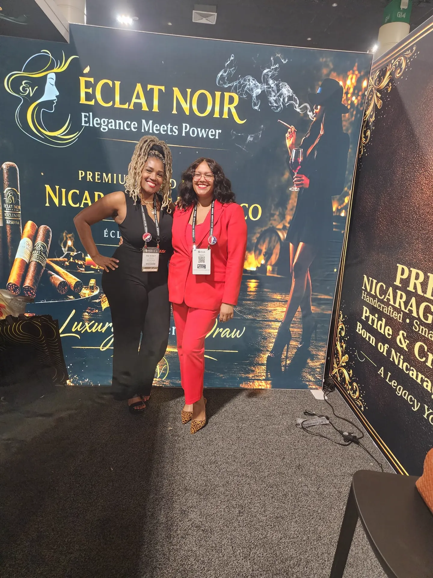 Founder and CEO L. Howard with an attendee beside the ÉCLAT NOIR and Nicaraguan tobacco banners, PCA Trade Show, New Orleans, April 2026.